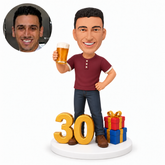 custom bobblehead figure man raising a beer mug beside a number 30 and gifts
