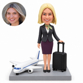 custom bobblehead figure female flight attendant with a rolling suitcase and a passenger airplane on the base