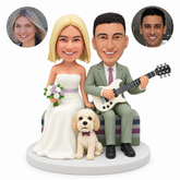 custom bobblehead figures wedding couple seated with an electric guitar and bouquet beside a fixed floppy-eared dog
