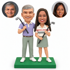 custom bobblehead figures golfing couple with the man holding a club and wrapping an arm around the woman who holds a second club with both hands