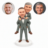 custom bobblehead figures two men in formal suits with the front man carrying the other man piggyback