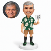 custom bobblehead figure man in a tropical shirt and shorts holding a best dad flag in his left hand with his right arm down