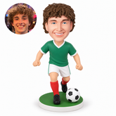 custom bobblehead figure male soccer player running with both fists low at his sides and a football beside his forward foot