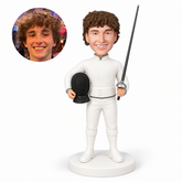 custom bobblehead figure male fencer standing with a mask at his waist and a foil held upright
