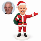 custom bobblehead figure male Santa holding a shoulder sack with his other arm extended outward