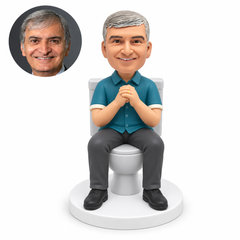 custom bobblehead figure fully clothed man seated on a toilet with both hands clasped at his chest