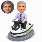 custom bobblehead figure man seated on a personal watercraft holding both handlebar ends