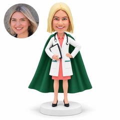 custom bobblehead figure female doctor with a long cape holding a clipboard against her waist and her other hand on her hip