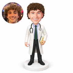 custom bobblehead figure male doctor holding a small baseball in one lowered hand and a closed book in the other