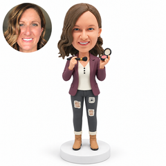 custom bobblehead figure female makeup artist holding a makeup brush in her right hand and an open compact in her left