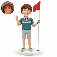 custom bobblehead figure male golfer holding a putting flag in his left hand and a golf ball near his right shoulder