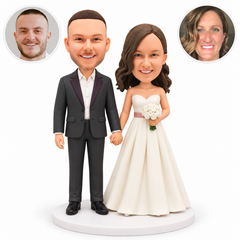 custom bobblehead figures wedding couple holding hands low with the groom on the left and the bride holding a bouquet in her left hand