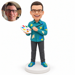 custom bobblehead figure male artist holding a palette at his chest with his right hand and directing a paintbrush toward it with his left