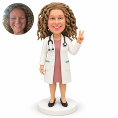custom bobblehead figure female doctor raising a peace sign with her left hand and keeping her right arm lowered