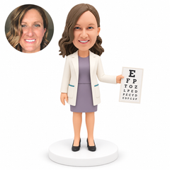 custom bobblehead figure female eye doctor holding an eye chart in her left hand with her right arm lowered