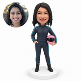 custom bobblehead figure female racer holding a full-face helmet at her left hip with her right hand in her pocket