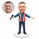 custom bobblehead figure male singer with both arms extended sideways holding a microphone and parallel planted feet