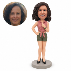 Custom woman in tied-front blouse and shorts bobblehead with one hand on hip and one at collar