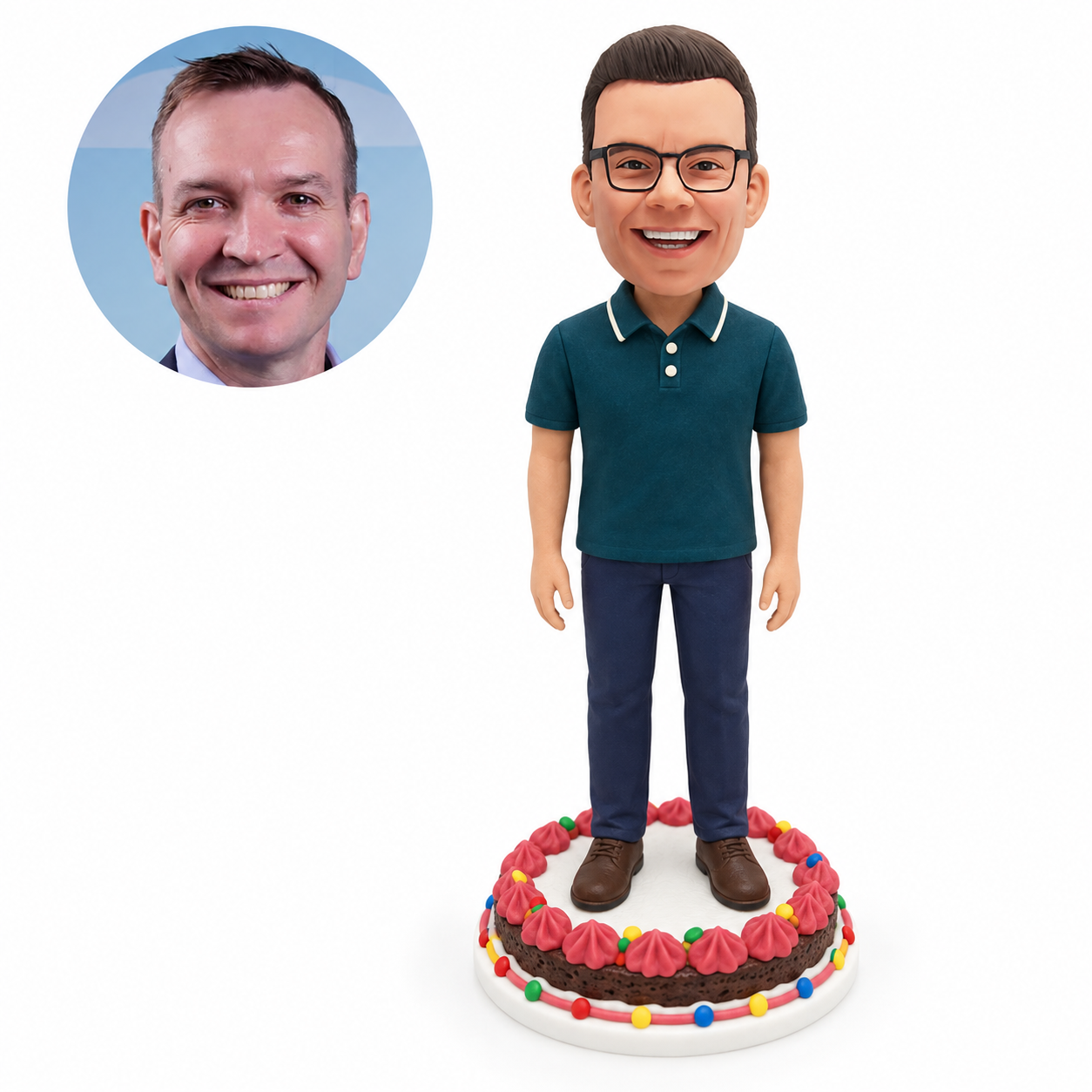 Custom soft-clay bobblehead man with both arms at his sides on a full decorated birthday cake base, with matching real-photo portrait