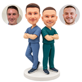 custom bobblehead figures two male nurses standing back to back with crossed arms and one bent leg