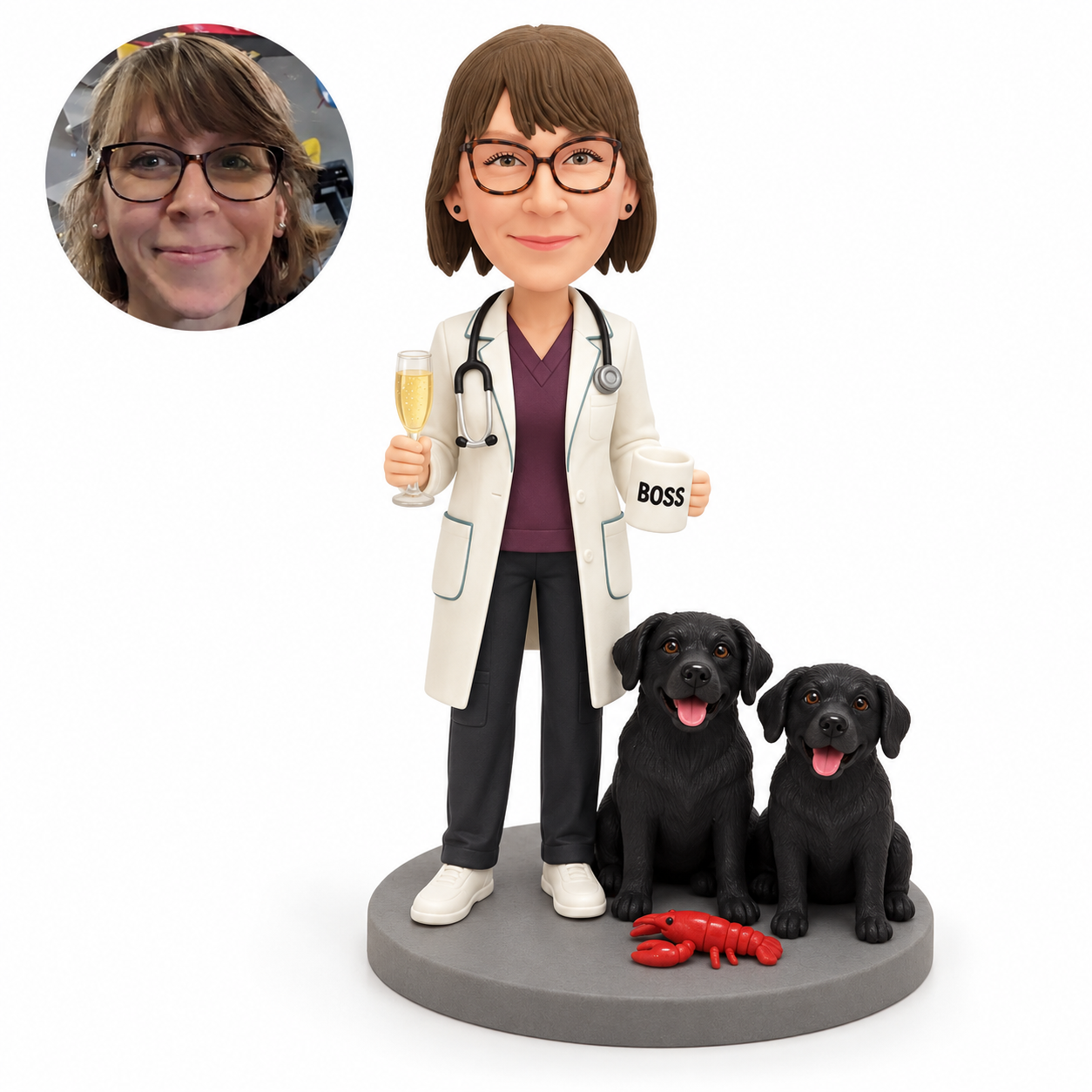 Custom clay female doctor holding a champagne flute and mug beside two fixed black dogs on a gray base, with matching real portrait
