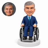 custom bobblehead figure businessman seated in a wheelchair