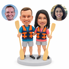 custom bobbleheads figures couple holding paddles in flotation vests