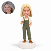 custom bobblehead figure woman in overalls holding a coffee cup