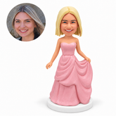 custom bobblehead figure woman in a pink gown holding her skirt
