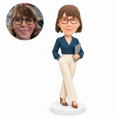 custom bobblehead figure businesswoman in a wrap blouse holding a folder