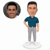 custom bobblehead figure businessman in a teal polo with a hand on hip