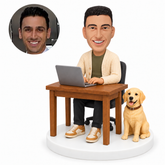 custom bobblehead figure man working at a laptop beside a dog