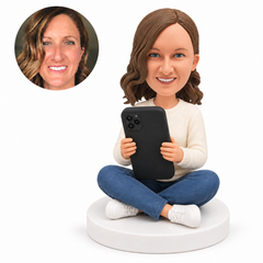 custom bobblehead figure woman sitting cross legged with a large phone