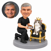 custom bobblehead figure man kneeling beside a crowned cat on a throne