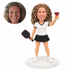 custom bobblehead figure female pickleball player holding a wine glass
