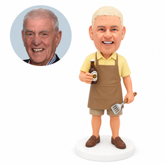 custom bobblehead figure man in an apron holding a beer bottle and spatula