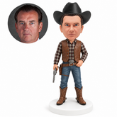 custom bobblehead figure cowboy in a vest holding a revolver at his side