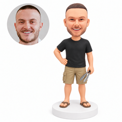 custom bobblehead figure man holding barbecue tongs with one hand on his hip