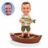 custom bobblehead figure fisherman holding a fish in a rowboat with two oars