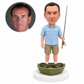 custom bobblehead figure man holding a fishing rod in a small rowboat