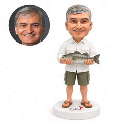 custom bobblehead figure fisherman holding a fish beside a fishing float and hook