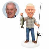 custom bobblehead figure fisherman in a plaid shirt raising a fish with a fishing rod