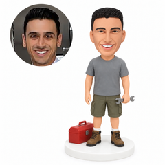 custom bobblehead figure worker holding a wrench beside a toolbox