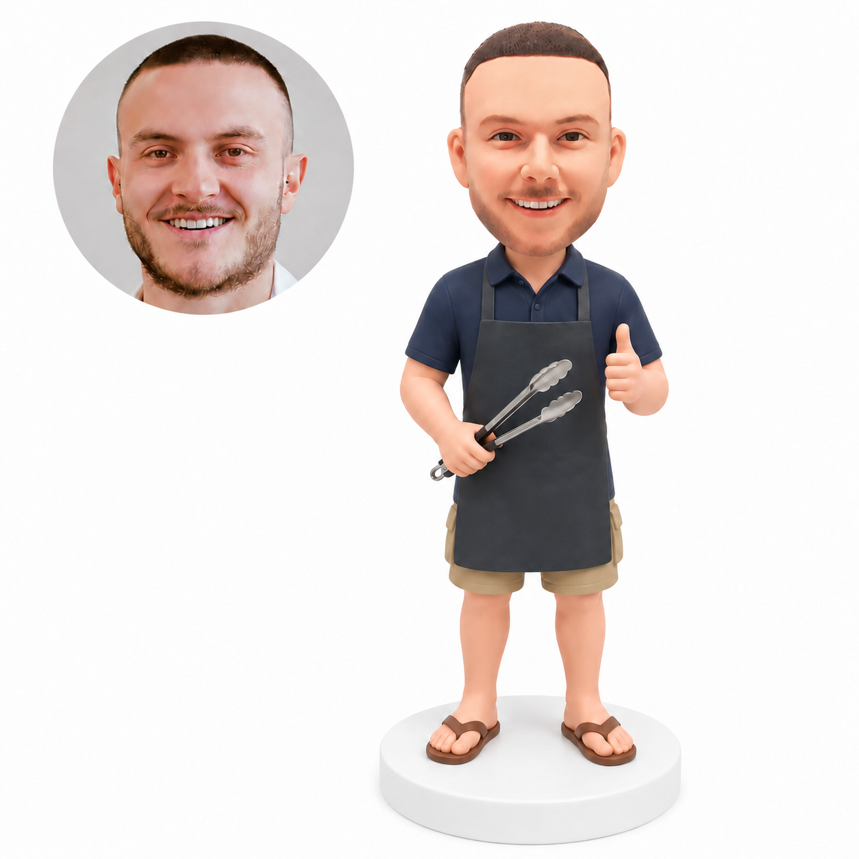custom bobblehead figure man in an apron holding barbecue tongs and giving a thumbs up