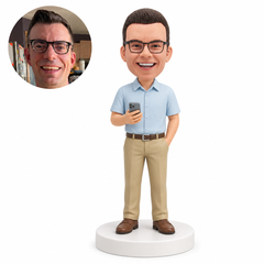 custom bobblehead figure man in a short sleeve button shirt holding a phone with a hand in his pocket