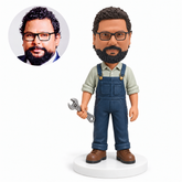custom bobblehead figure mechanic in overalls holding an adjustable wrench at his side