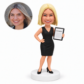 custom bobblehead figure female lawyer in a sleeveless dress holding a document