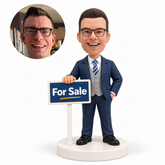 custom bobblehead figure male real estate agent in a vest suit with one hand on a sign