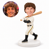 custom bobblehead figure male baseball player carrying a bat over one shoulder while stepping forward