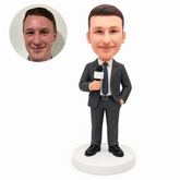custom bobblehead figure male reporter holding a microphone with one hand in a pocket